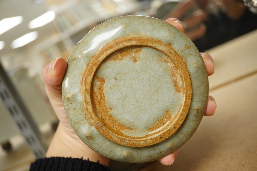 A Chinese celadon glazed box and cover and two similar bowls, largest 15cm diameter. Condition - varies